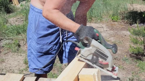The carpenter works with the circular saw. Stock Footage 90288729
