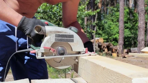 The carpenter works with the circular saw. Stock Footage 90289278