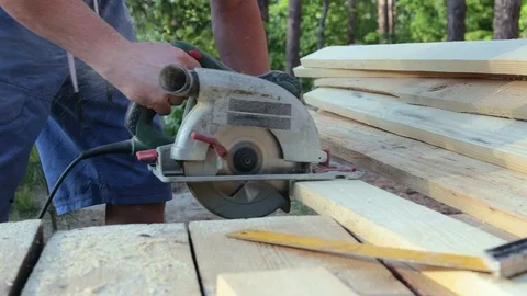 The carpenter works with the circular saw. Stock Footage 90291478