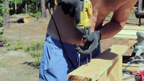 The carpenter works with the drill. Stock Footage 90338878
