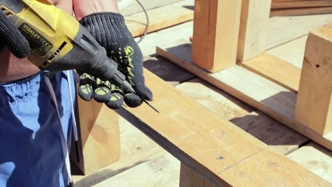 The carpenter works with the drill. Stock Footage 90338981
