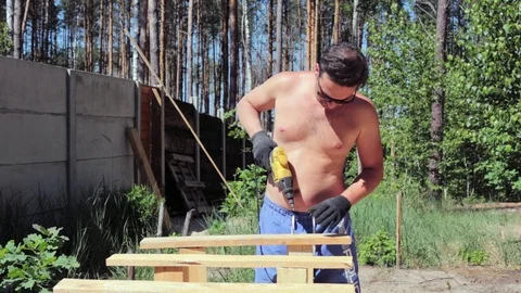 The carpenter works with the drill. Video stock 90339100
