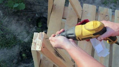 The carpenter works with the drill. Video stock 90339834