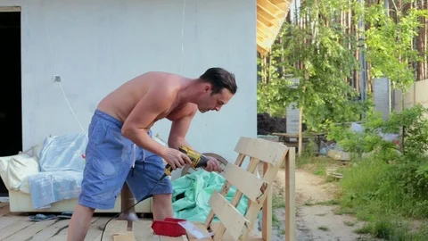 The carpenter works with the drill. Stock Footage 90340114