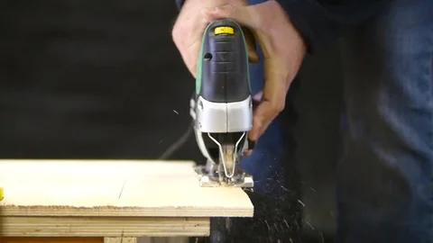 Carpenter works as a jigsaw Stock Footage 93273321