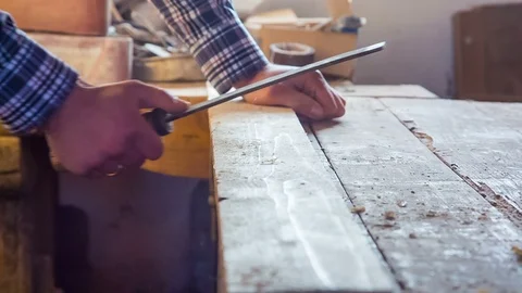 The carpenter works with rasp when processing the board. Close-up Stock Footage 87920519