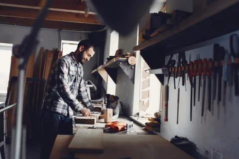 The carpenter works with a tree Stock Photos