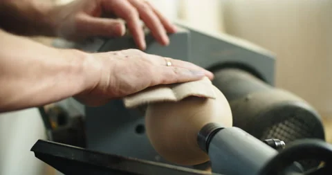 A carpenter works in a workshop. Joiner's grinders, furniture manufacturing. A Stock Footage 170195939