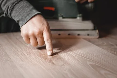 A carpenter works in a workshop. Joiner's grinders, furniture manufacturing.  Stock Photos