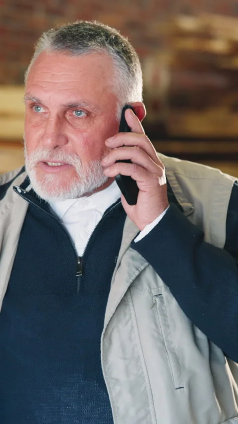 Carpenter, workshop and mature man with phone call, talking and update for Stock Footage 343816935