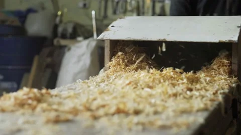 A carpenter in the workshop works on a woodworking machine, processes wood for Stock Footage 196938025