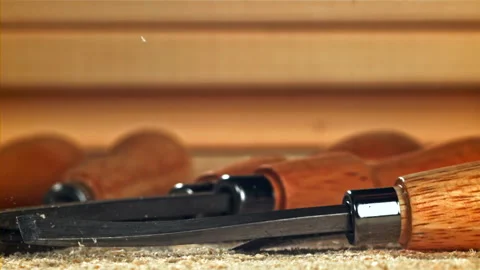 The carpenter's chisel falls on the table. Filmed on a high-speed camera at 1000 Stock Footage 307928935