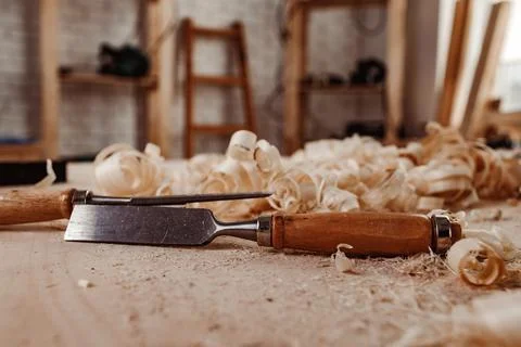 Carpenter's chisel, woodwork tool on the desktop in the workshop Stock Photos