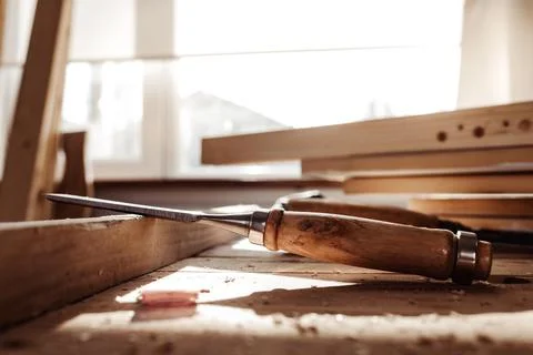 Carpenter's chisel, woodwork tool on the desktop in the workshop Stock Photos