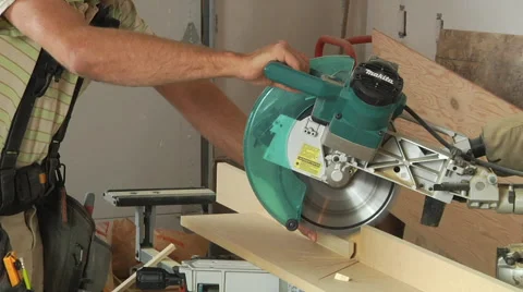 Carpenter's hands and Single Arm Multi-disc Stone Sawing Machine Stock Footage 57970059
