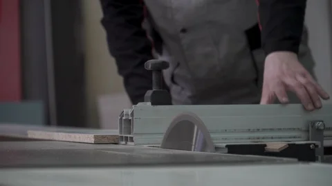 Carpenters using electric saw for sawing boards. Sawmill lumber production tree Stock Footage 89547418