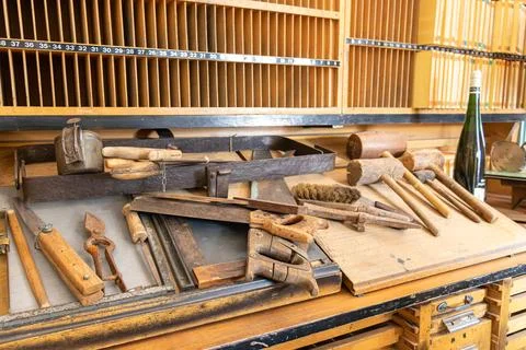 Carpenter's work workshop table with tools from the last century Stock Photos
