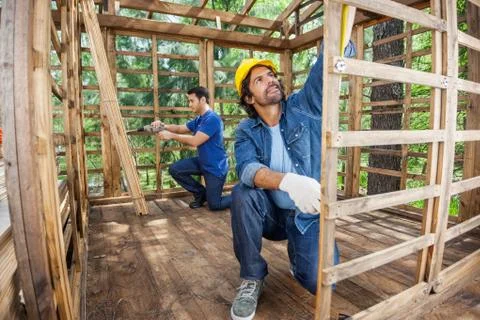 Carpenters Working At Construction Site 写真素材