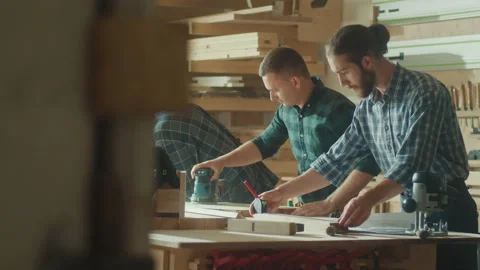 Carpenters Working in a Loft Studio on a New Product Design. Woodworking. Stock Footage 224170773