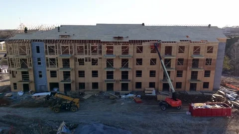 Carpenters Working On The Rooftop Of A Condo Building Construction Site, Rising Stock Footage 341344933