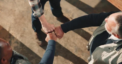 Carpentry, above and people with group fist, solidarity and team building in Stock Footage 341399786