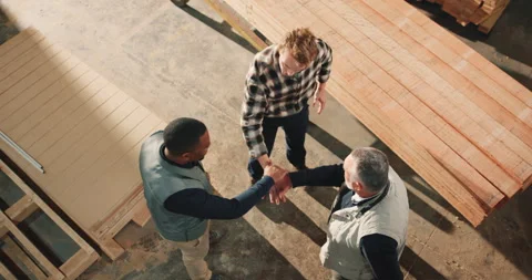 Carpentry, above or team in warehouse with handstack, support and motivation for Stock Footage 341312840