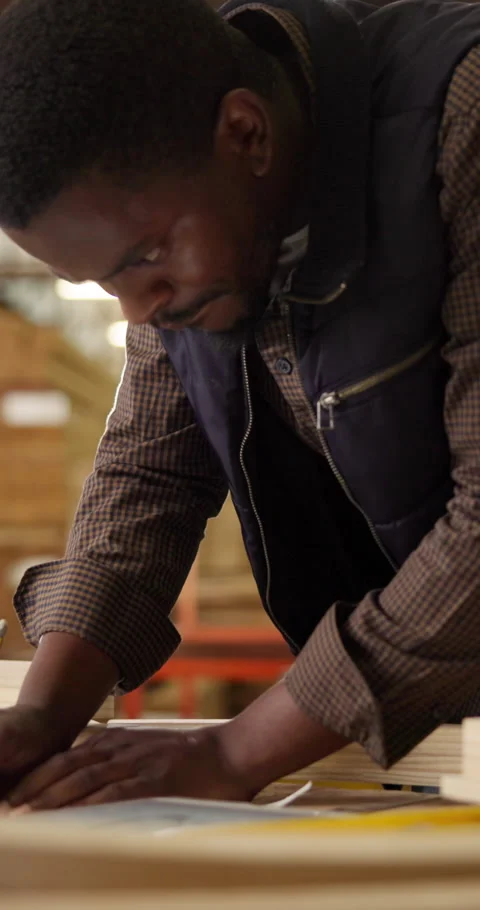 Carpentry, blueprint and black man with tablet, sketching document and draft of Stock Footage 340982430