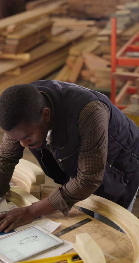 Carpentry, blueprint and engineer with tablet, sketching document and draft of Stock Footage 340959228