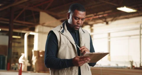 Carpentry, clipboard and black man in workshop for inventory, planning and Stock Footage 341311546