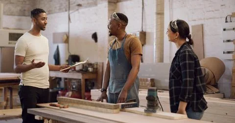 Carpentry, clipboard and talking with team in factory for manufacturing or .. Stock Photos