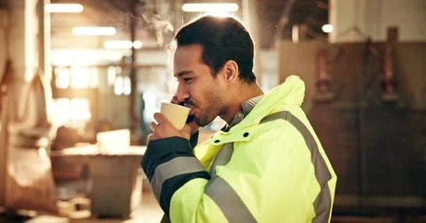 Carpentry, coffee and man in workshop for break, rest and recharge with caffeine Stock Photos