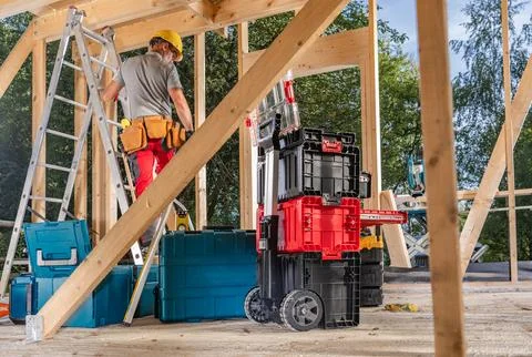 Carpentry Contractor Worker with His Tool Boxes Stock Photos