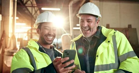 Carpentry, laugh and men in workshop with phone, online meme and internet joke Stock Photos