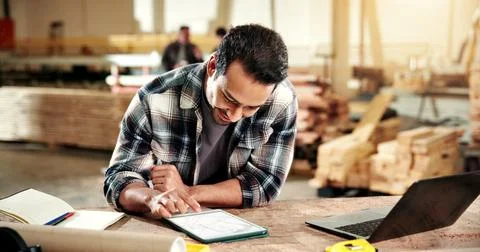 Carpentry, man and tablet screen in workshop for planning, digital blueprint and Stock Photos