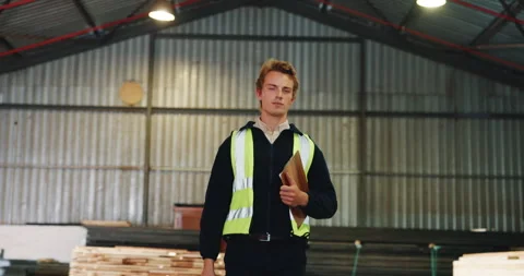Carpentry, man and walk with clipboard in warehouse for timber audit, quality Stock Footage 341396495