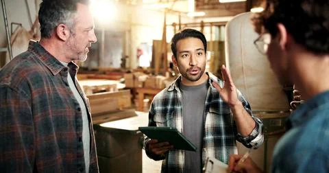 Carpentry, manager and meeting in workshop with tablet, explain furniture d.. Stock Photos