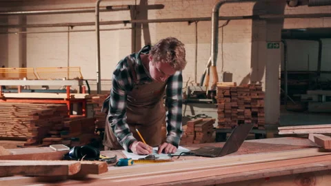 Carpentry, paper or man in workshop with laptop, stock check or process schedule Stock Footage 338009516