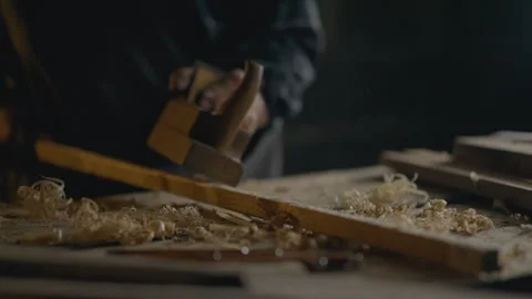 Carpentry, Skilled worker Masterfully Tool Wood planer planing wood Workplac Stock Footage 242449603