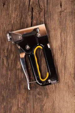 Carpentry stapler with yellow pen Stock Photos