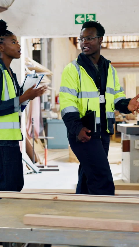 Carpentry, team and inspection in workshop with discussion, clipboard and review Stock Footage 340383116