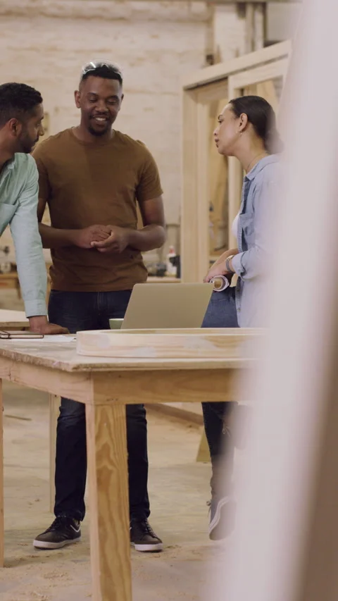 Carpentry, teamwork and people with laptop in workshop for furniture ideas, Stock Footage 330050596
