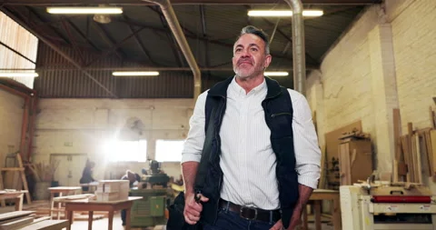 Carpentry, thinking and walking with happy man in factory for management of Stock Footage 340002245