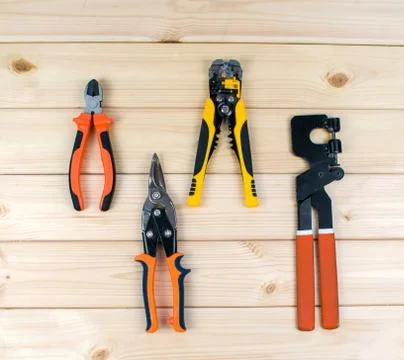 Carpentry tooling on table. Set of tools for repair, scissors, flat-nose plie Stock Photos