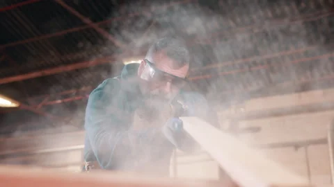 Carpentry, tools and man with sawdust in workshop for manufacturing, furniture Stock Footage 338046026