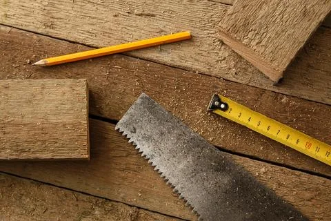 Carpentry tools on wooden surface Stock Photos