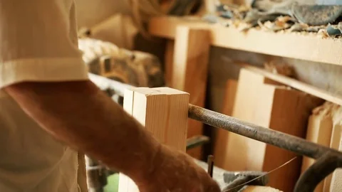 Carpentry, woodwork and people concept - carpenter working at workshop Stock Footage 81508563