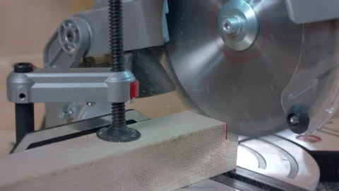 Carpentry work. Cutting disk cuts wood with laser ruler. Stock Footage 169359353