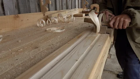 Carpentry work on wood. Carpenter planing a tree, close-up. Stock Footage 113541759