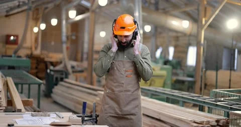 Carpentry worker having fun at the factory Stock Footage 146921466