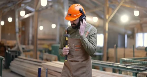 Carpentry worker having fun at the factory Stock Footage 146921604